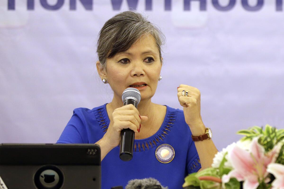 FILE - In this July 30, 2018, file photo, Vice President of the Cambodia National Rescue Party (CNRP), Mu Sochua speaks at a press conference in Jakarta, Indonesia. Senior executives of the disbanded opposition Cambodia National Rescue Party have announced their plan to return from self-imposed exile to fight criminal charges against them in court. (AP Photo/Tatan Syuflana, File)