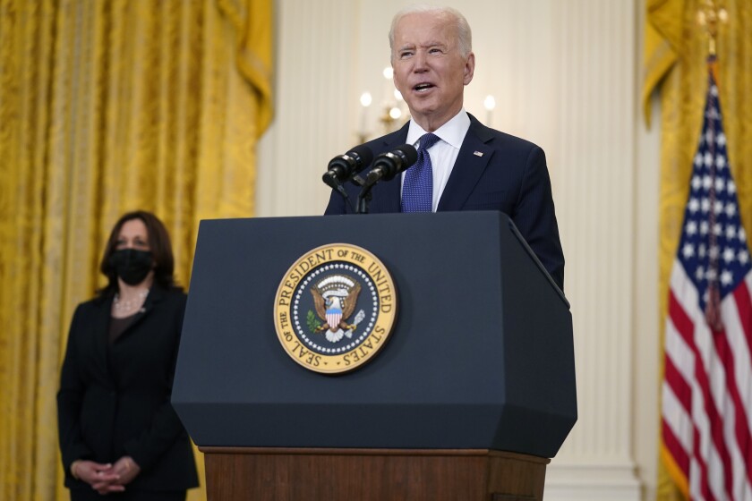 Vice President Kamala Harris, left, listens as President Joe Biden speaks about the economy, in the East Room of the White House, Monday, May 10, 2021, in Washington. (AP Photo/Evan Vucci)
