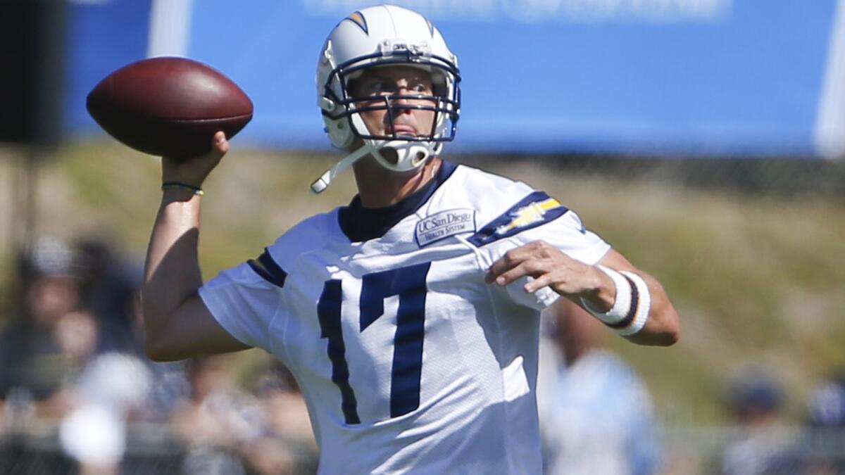 San Diego Chargers quarterback Philip Rivers makes a pass during a training camp drill on Thursday. Rivers has made an effort to build stronger relationships with the younger players on team.