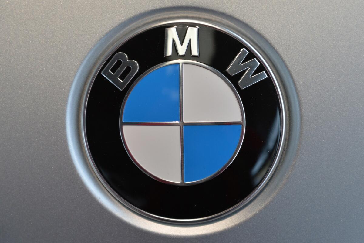 This 2014 file photo shows BMW's logo. BMW is recalling more than 154,000 cars and SUVs in the U.S. and Canada to fix a wiring problem that can cause engines to stall.
