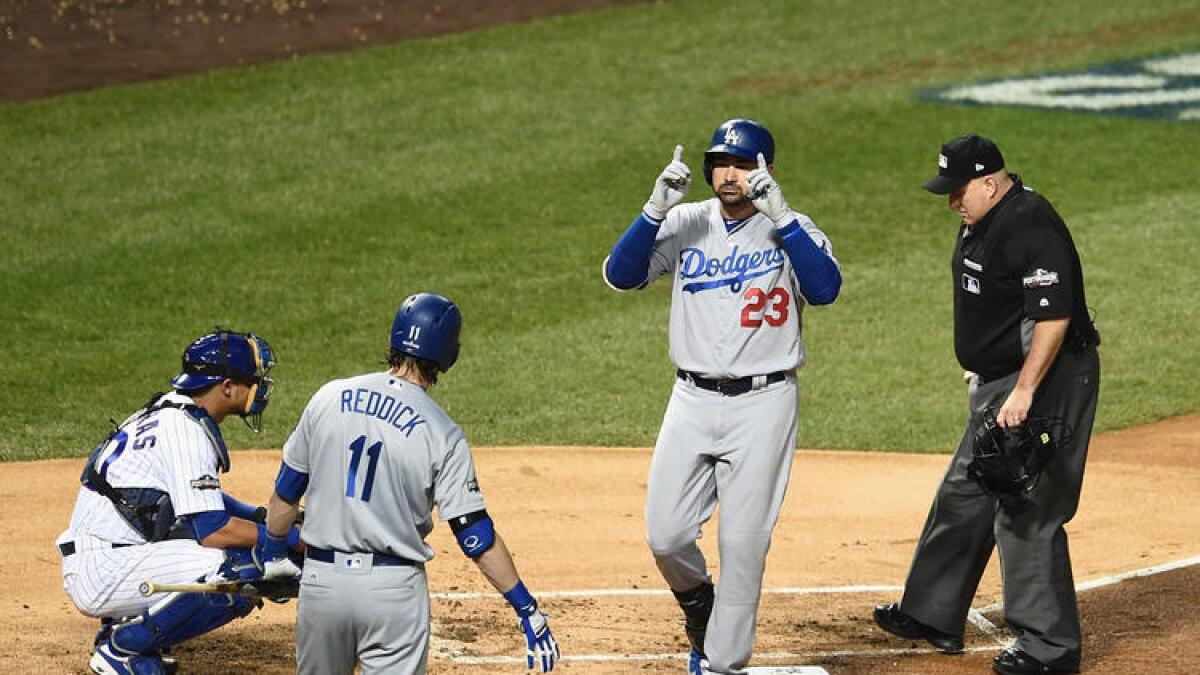 Adrian Gonzalez crosses home plate after homering in Game 2.