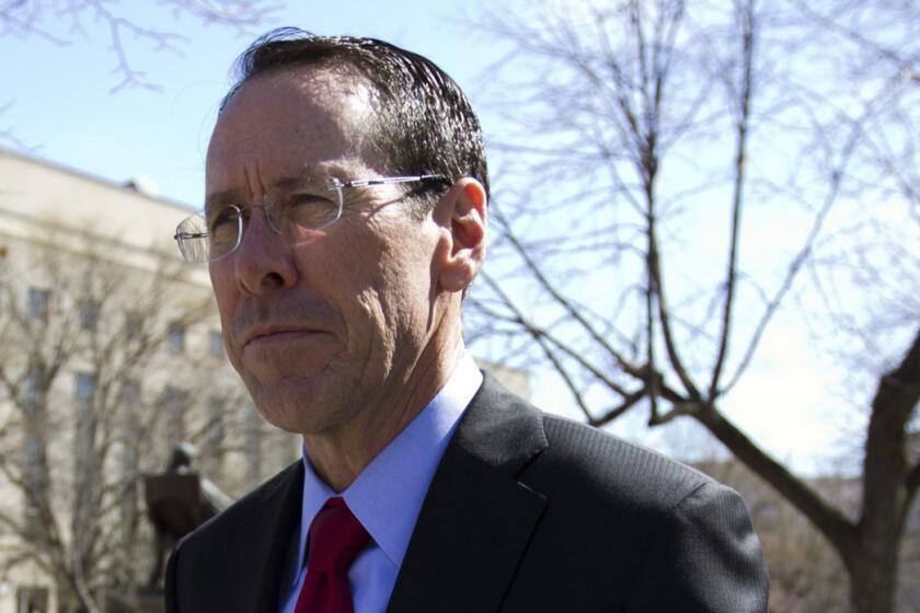 FILE- In this March 22, 2018, file photo, AT&T CEO Randall Stephenson leaves the federal courthouse in Washington. The judge presiding over the government's legal effort to block AT&T's purchase of Time Warner will likely deliver his verdict on Tuesday, June 12. (AP Photo/Jose Luis Magana, File)