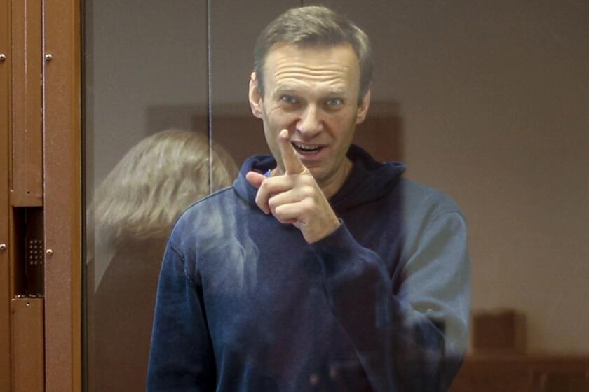 FILE - In this Feb. 16, 2021, file photo taken from footage provided by the Babuskinsky District Court, Russian opposition leader Alexei Navalny gestures during a court hearing in Moscow, Russia. Several doctors were prevented Tuesday, April 20, from seeing Navalny in a prison hospital after his three-week hunger strike, and prosecutors also detailed a sweeping, new case against his organization. (Babuskinsky District Court Press Service via AP, File)