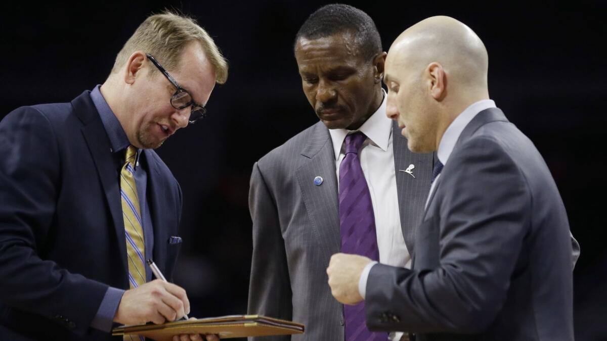 Rex Kalamian huddles with Dwane Casey, center, and Nick Nurse last season with the Raptors.