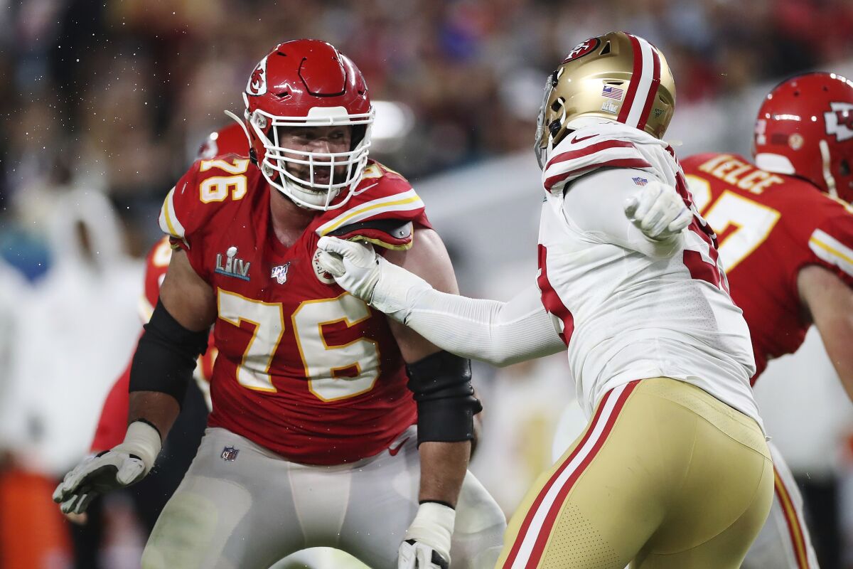 FILE - Kansas City Chiefs offensive guard Laurent Duvernay-Tardif (76) blocks San Francisco 49ers defensive tackle DeForest Buckner (99) during the second half of the NFL Super Bowl 54 football game between the San Francisco 49ers and Kansas City Chiefs Sunday, Feb. 2, 2020, in Miami Gardens, Fla. The New York Jets added some depth to the offensive line, acquiring guard Laurent Duvernay-Tardif from the Kansas City Chiefs for tight end Daniel Brown ahead of the NFL's trade deadline Tuesday, Nov. 2, 2021. (AP Photo/Steve Luciano, File)