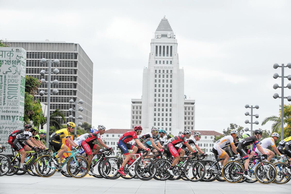 Fitness tracking app Strava bestows a virtual crown to the fastest riders completing specific routes. Above, racers in the Amgen Tour of California in downtown L.A. last year.