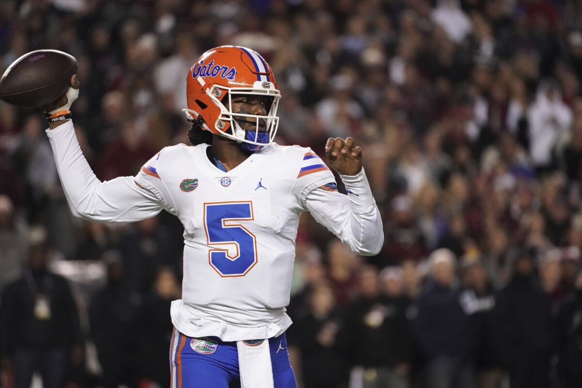 Florida quarterback Emory Jones throws a pass during the first half of the team's NCAA college football game against South Carolina on Saturday, Nov. 6, 2021, in Columbia, S.C. (AP Photo/Sean Rayford)