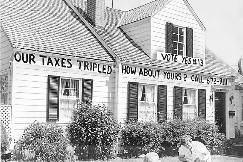 A California homeowner shows support for Proposition 13 in 1978. A recent poll found only slim support for changing the measure to exempt commercial properties from the landmark tax limitations.