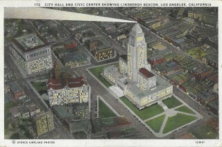 The Lindbergh Beacon shines from Los Angeles City Hall on a vintage postcard