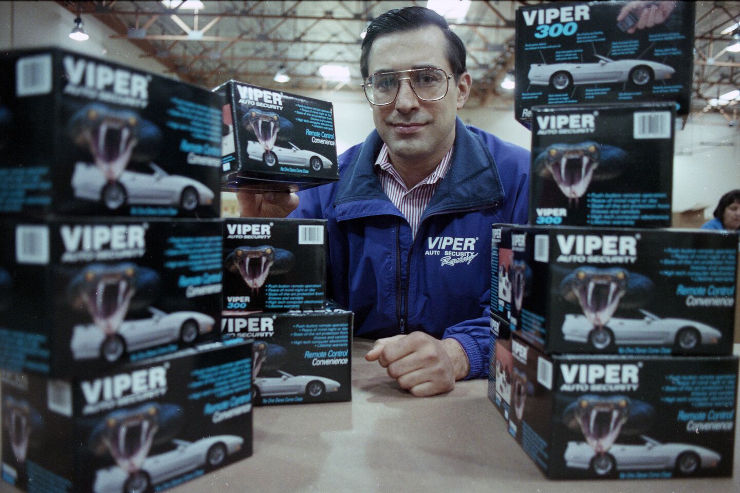 This 1992 file photo shows Darrell Issa, president of Directed Electronics Inc., with the company Viper brand radar detectors. Issa bought a struggling Cleveland electronics business and within a decade transformed it to produce the popular Viper automobile anti-theft device, with Issa's voice as the warning to would-be thieves to "stand back." He and his wife, Kathy, moved to Vista in 1985.