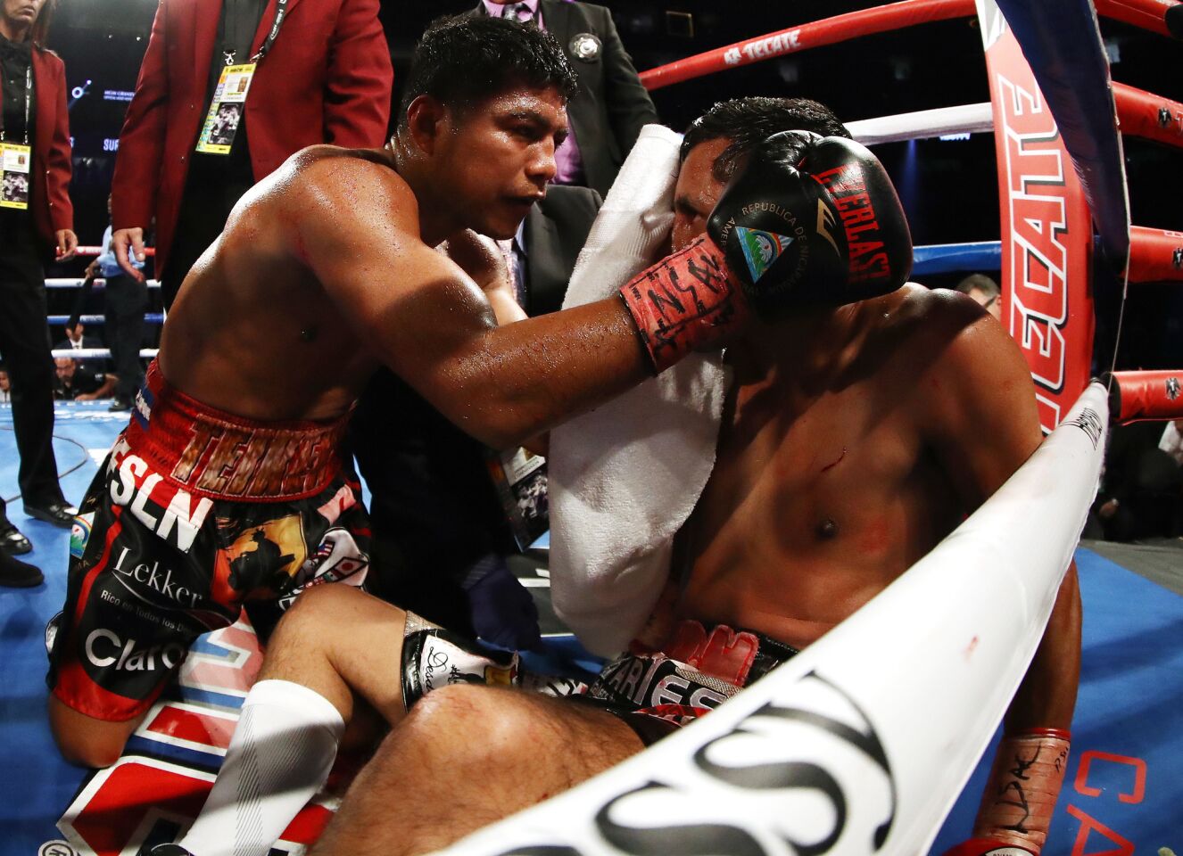 Roman Gonzalez consoles Moises Fuentes after knocking him out in the first round during their super flyweight bout at T-Mobile Arena on September 15, 2018 in Las Vegas, Nevada.