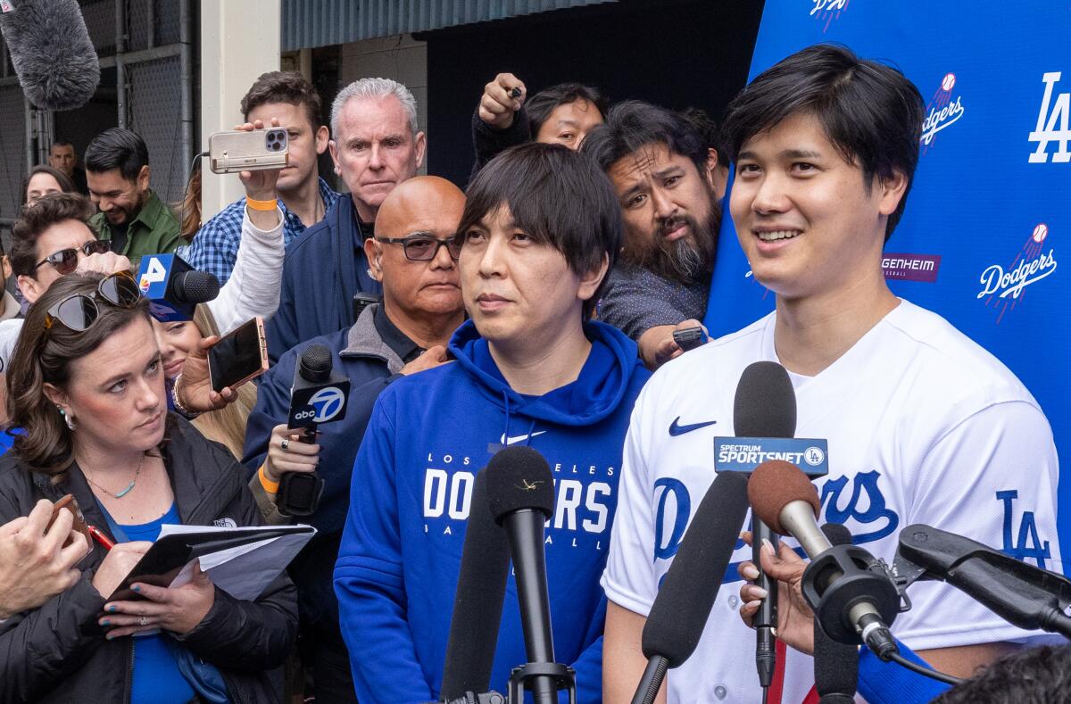 Dodgers star Shohei Ohtani talks the media during DodgerFest on Feb. 3, 2024 in Los Angeles.