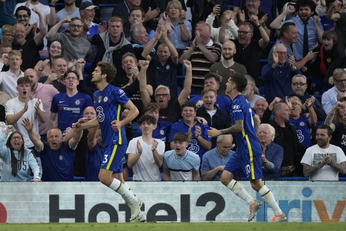 Chelsea's Marcos Alonso, left, celebrates after scoring his side's opening goal during the English Premier League soccer match between Chelsea and Leicester City at Stamford Bridge stadium in London, Thursday, May 19, 2022. (AP Photo/Frank Augstein)