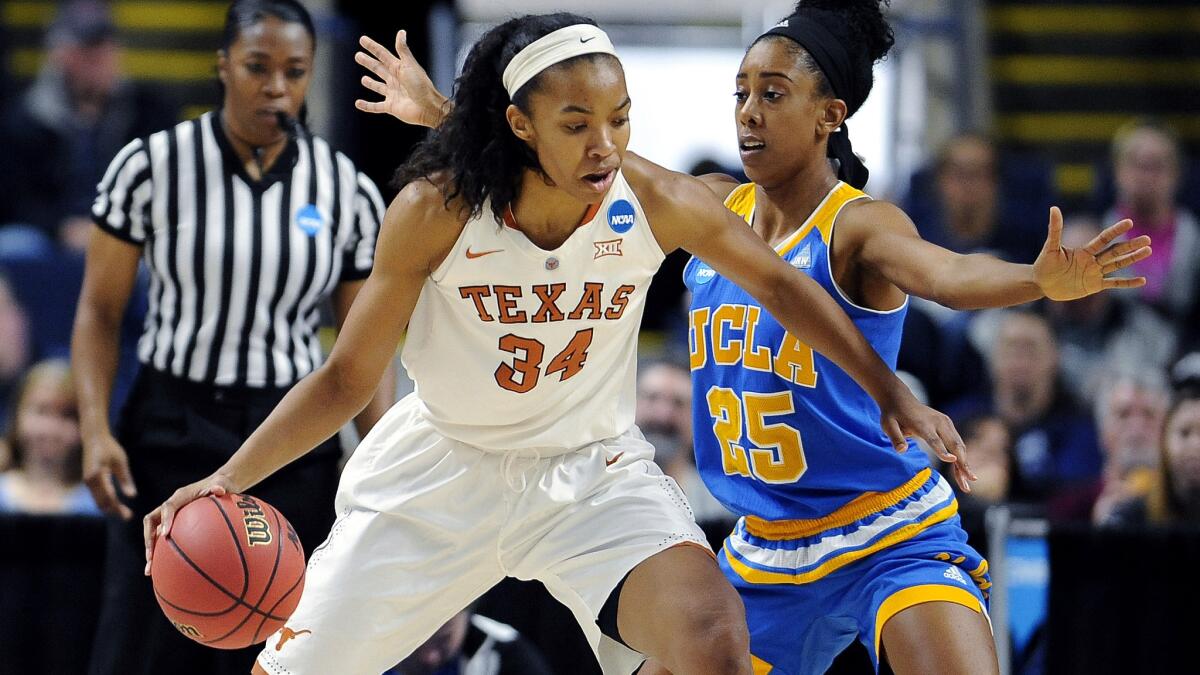 Texas center Imani Boyette works in the post against UCLA forward Monique Billings during the first half Saturday.