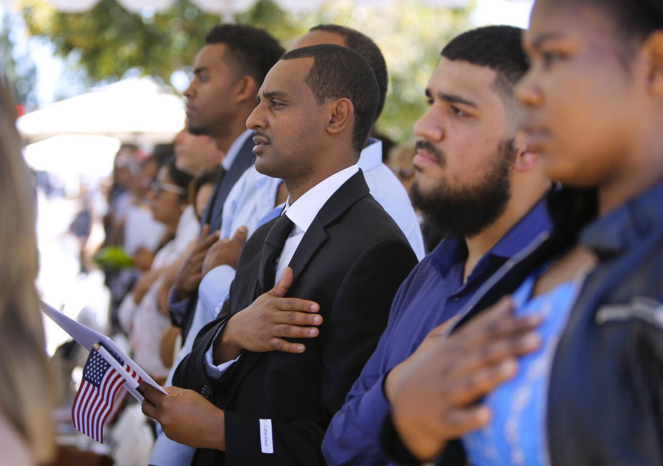 About 100 people from about 54 countries took the Oath of Allegiance to the United States of America and became U.S. citizens during a naturalization ceremony held in Centennial Plaza near El Cajon City Hall to kickoff El Cajon's, America on Main Street festivities.