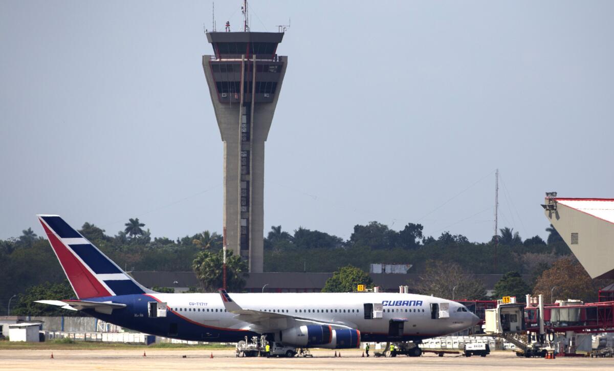 A Cubana Airlines aircraft is stationed at the international terminal of the Jose Marti Airport in Havana. Several U.S. carriers have applied for permission from the U.S. Department of Transportation to fly regular routes to Cuba.