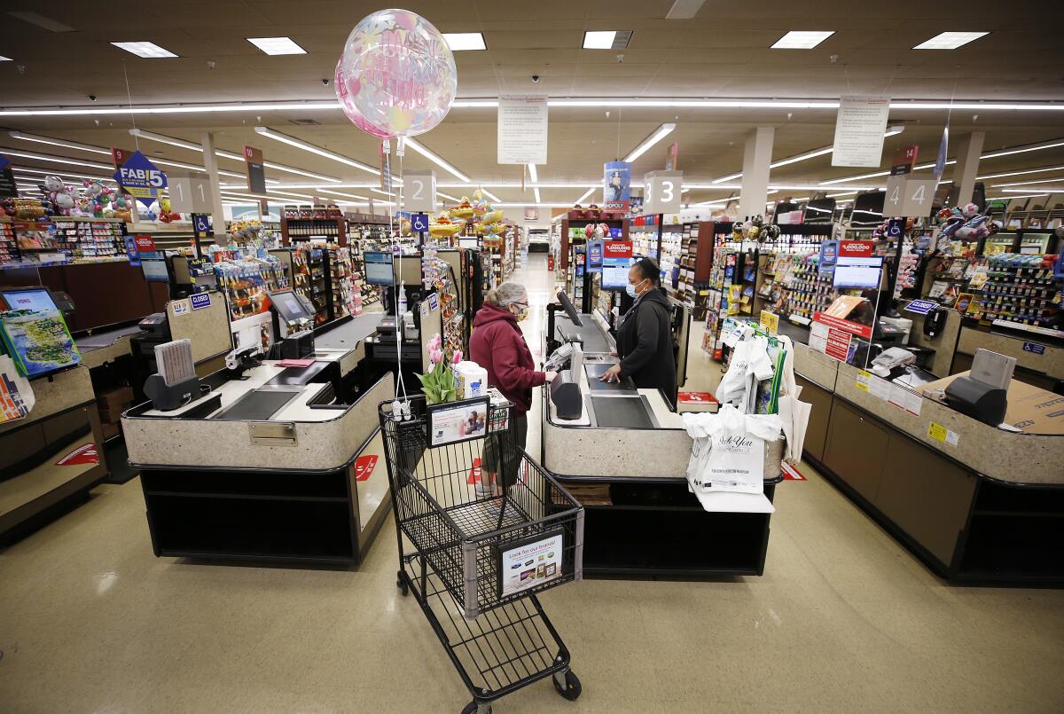 A shopper checks out at Vons in Torrance in 2020. 