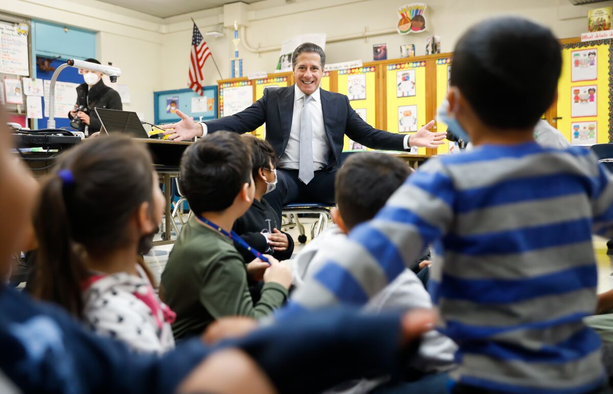 L.A. schools Supt. Alberto Carvalho greets first-graders in Los Angeles.