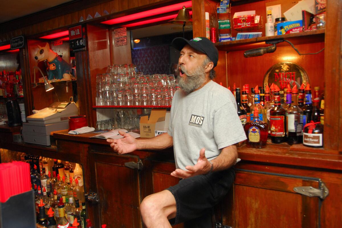 Bartender John Madrid entertains the morning patrons at Guthrie's Alley Cat Alley Cat on Wall Street in Bakersfield.