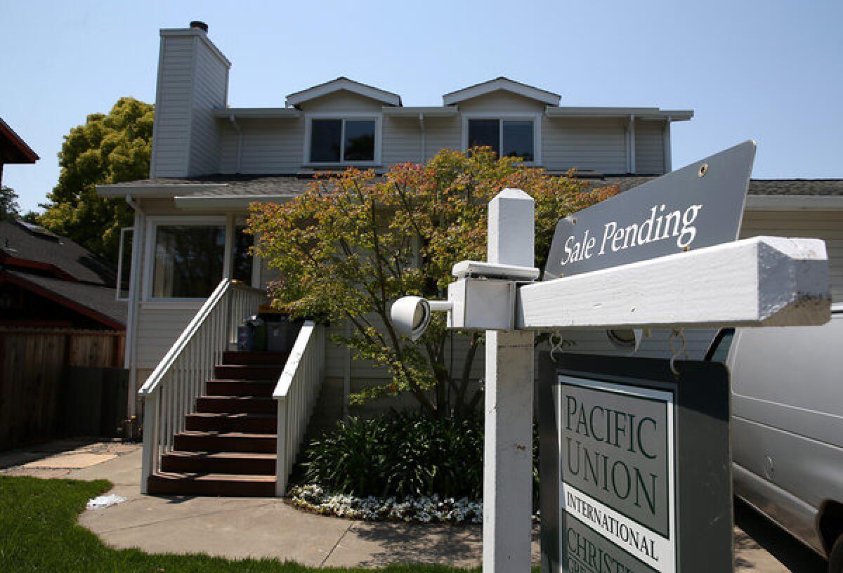 A "sale pending" sign is posted in front of a home in San Anselmo, Calif.