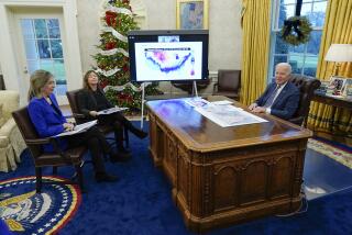 President Joe Biden participates in a briefing on winter storms across the United States in the Oval Office of the White House, Thursday, Dec. 22, 2022, in Washington. Liz Sherwood-Randall, assistant to the President, Homeland Security Advisor & Deputy National Security Advisor, left, and Julie Chavez Rodriguez, senior advisor to the President and Director of the Office of Intergovernmental Affairs, second from left. (AP Photo/Patrick Semansky)