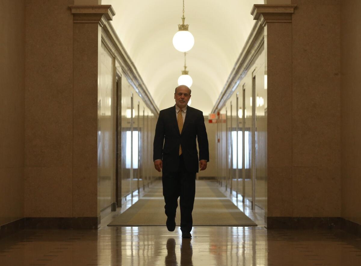 Federal Reserve Chairman Ben S. Bernanke walks out of his Washington, D.C., office Friday for the last time as head of the central bank.