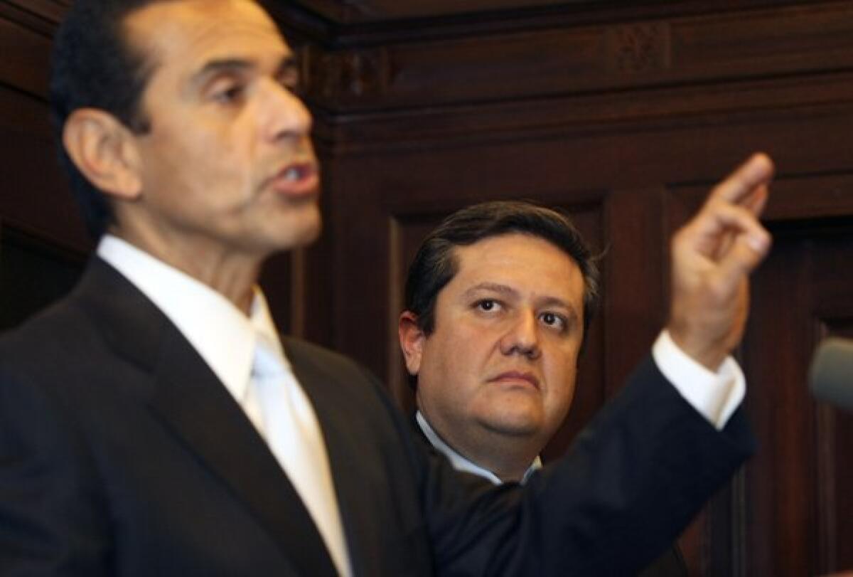 Mayor Antonio Villaraigosa makes a point in 2010 as City Administrative Officer Miguel Santana listens; where do you stand on city employee union members and their unwillingness to compromise?