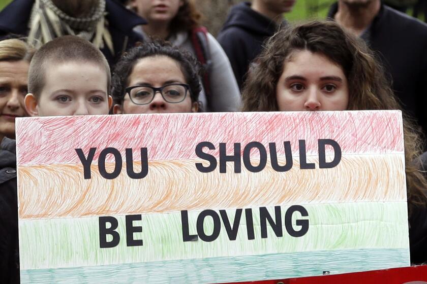 Protesters gather before marching through the streets in Portland, Ore., Wednesday, Nov. 16, 2016. Approximately 100 students at Portland State University joined a nationwide campus walkout to protest President-elect Donald Trump. (AP Photo/Don Ryan)