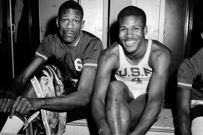 K.C. Jones, captain of the University of San Francisco Dons, right, is shown with teammate Bill Russell, March 1, 1956. (AP Photo/Robert Houston)