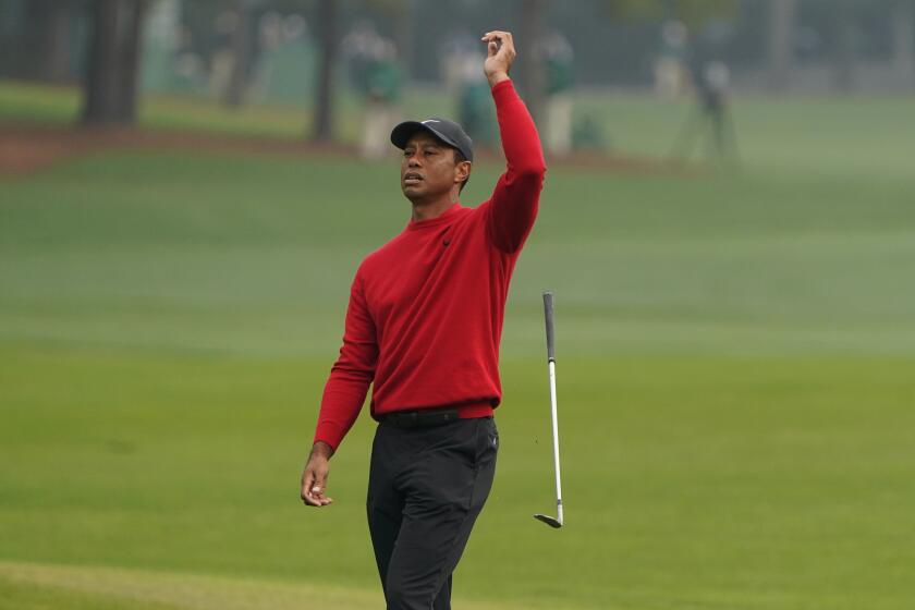Tiger Woods reacts after a near chip in on the second hole during the final round of the Masters golf tournament Sunday, Nov. 15, 2020, in Augusta, Ga. (AP Photo/Chris Carlson)