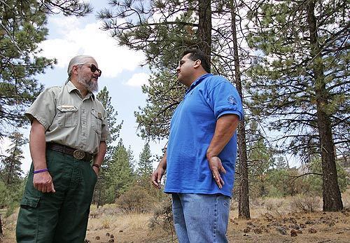 Doug McKay, left, a U.S. Forest Service archeologist, and James Ramos, the cultural resource coordinator for the San Manuel Band of Mission Indians, visit the site of a prehistoric village in the San Bernardino Mountains. In the past, tribal representatives were left in the dark about firefighting operations and fire officials had little clue about the historical significance of ancient sites threatened by blazes.