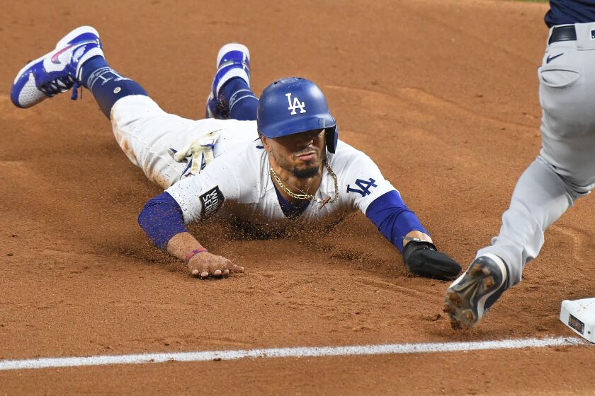 ARLINGTON, TEXAS OCTOBER 20, 2020-Dodgers Mookie Betts steals 3rd base against the Rays in the 5th inning in Game 1 of the World Series at Globe Life Field in Arlington, Texas Tuesday. (Wally Skalij/Los Angeles Times)