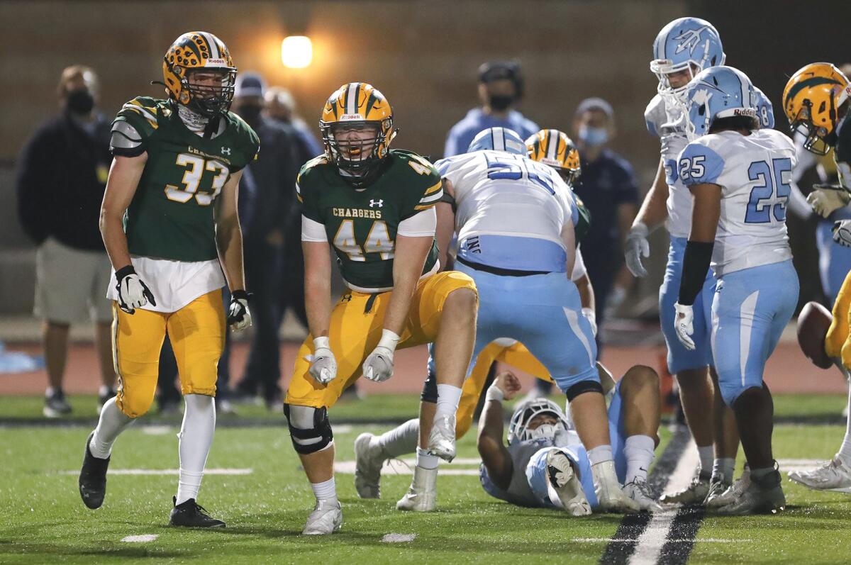 Edison's Brock Sale (44) reacts after sacking quarterback David Rasor in a Sunset League game against Corona Del Mar.