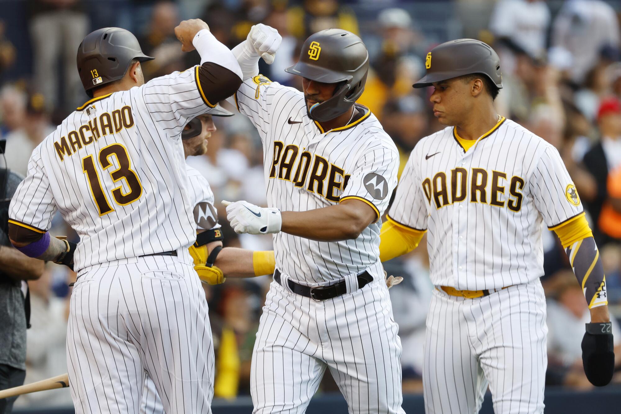 San Diego Padres third baseman Manny Machado, left celebrates with