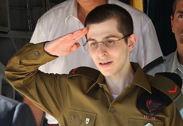 Israeli soldier Gilad Shalit salutes after stepping off a helicopter that carried him to Tel Nof airbase after his release by Hamas.