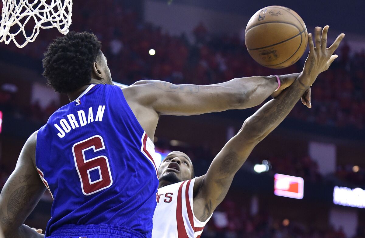 Clippers center DeAndre Jordan blocks a shot by Rockets forward Trevor Ariza in Game 7 of the NBA playoffs series against Houston.