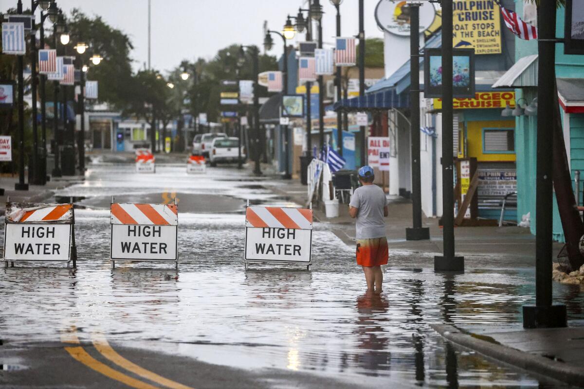 Flood water blocks a road in Tarpon Springs, Fla.