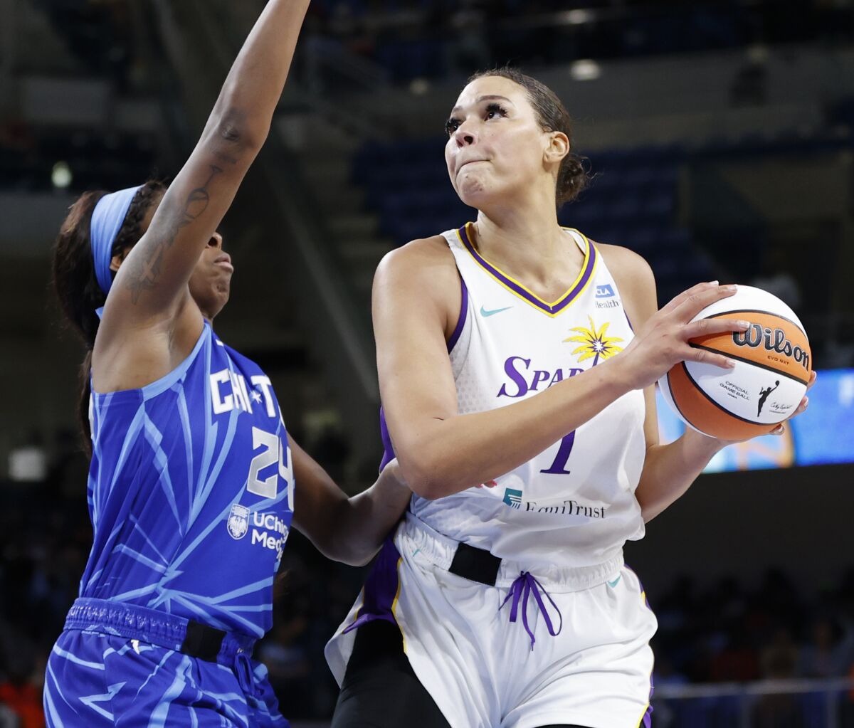 Liz Cambage drives to the basket against Chicago Sky.