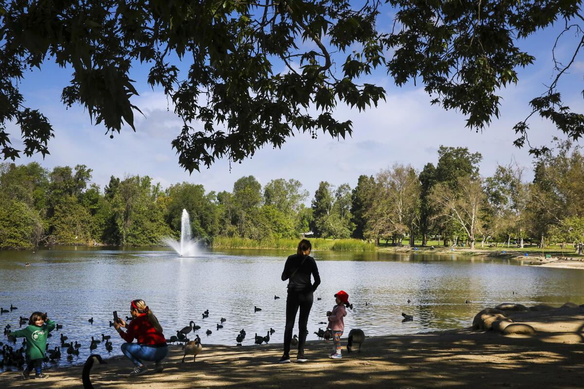 People enjoy a sunny day at Whittier Narrows Park in South El Monte on Saturday.