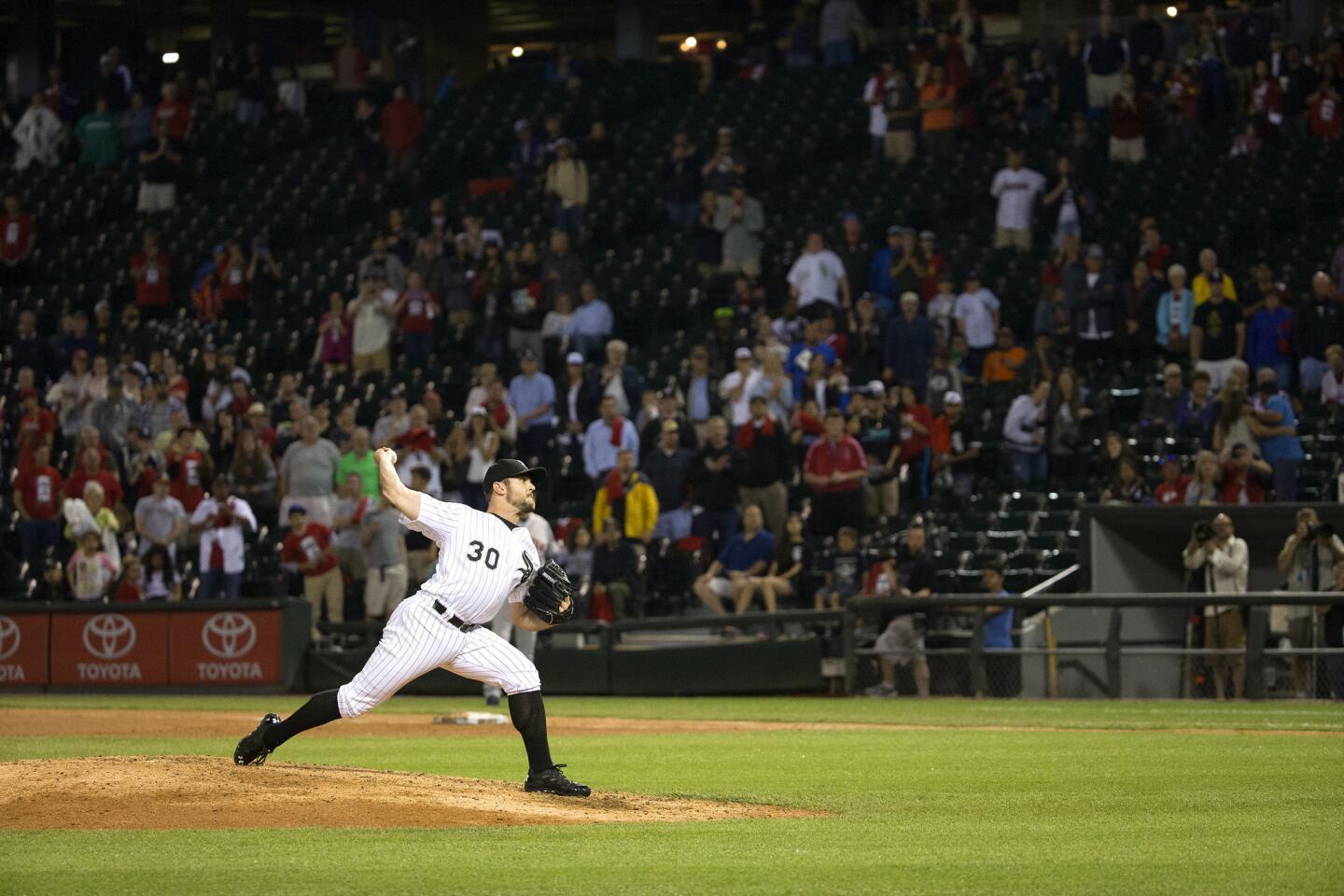 David Robertson throws the final pitch to end the game.
