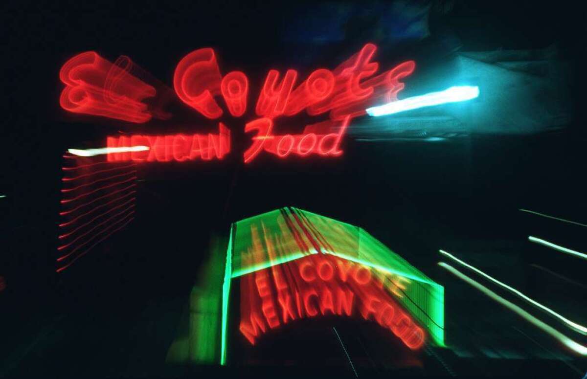 Red and green neon sign that reads El Coyote Mexican Food