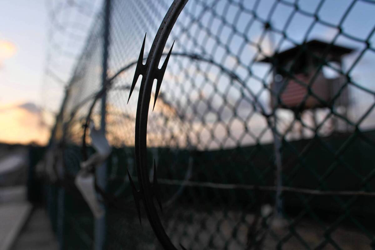 The sun rises over the Guantanamo detention facility at dawn, where detainees are waging a hunger strike.