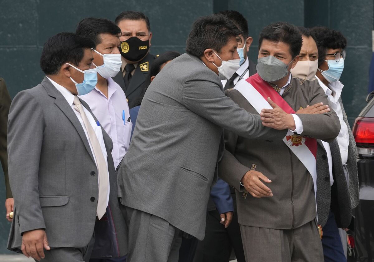 Peruvian President Pedro Castillo accompanied by lawmakers