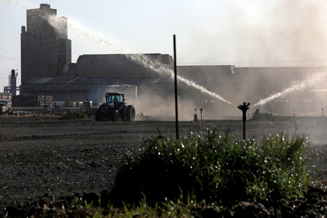 Irrigation sprinklers blast water along Bethel Avenue in Kingsburg. 