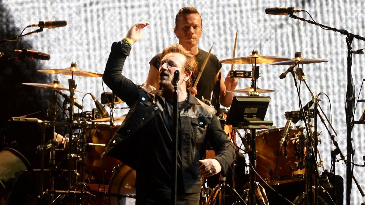 Members of U2 perform during the opening concert of their "Joshua Tree" tour in Vancouver last week. They perform in Pasadena Saturday and Sunday.