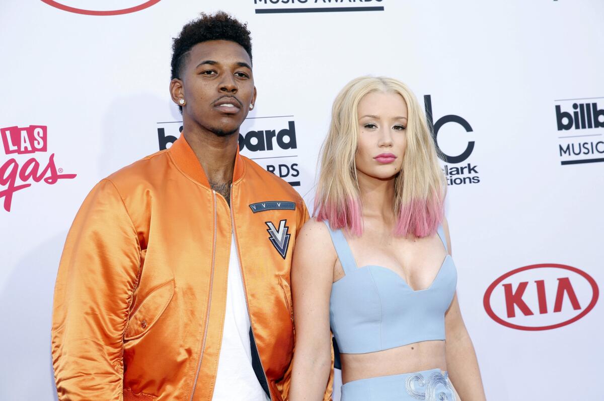 Lakers player Nick Young and rapper Iggy Azalea are engaged.