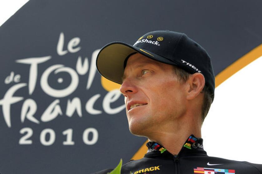 Lance Armstrong stands on the podium after the 20th and last stage of the Tour de France.
