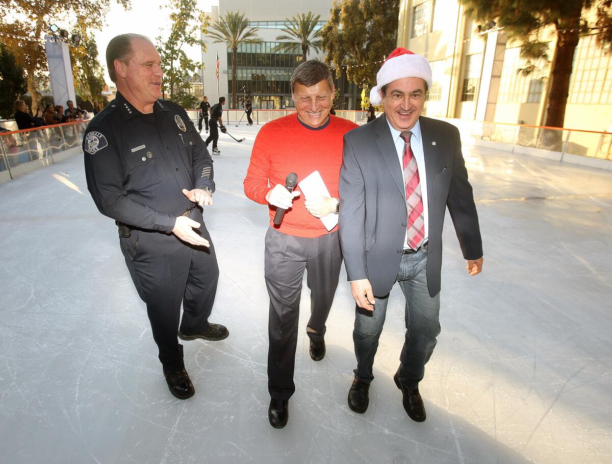 Glendale Police Chief Carl Povilaitis, Mayor Ara Najarian and City Councilman Vartan Gharpetian leave a Nov. 22 event to mark the opening of a temporary ice rink on the parking lot behind Glendale City Hall. “There are some grinches out there who wanted to steal Christmas..." Najarian said, referring to naysayers of the $500,000 installation. A reader writes to comment on being called a Grinch by the mayor.