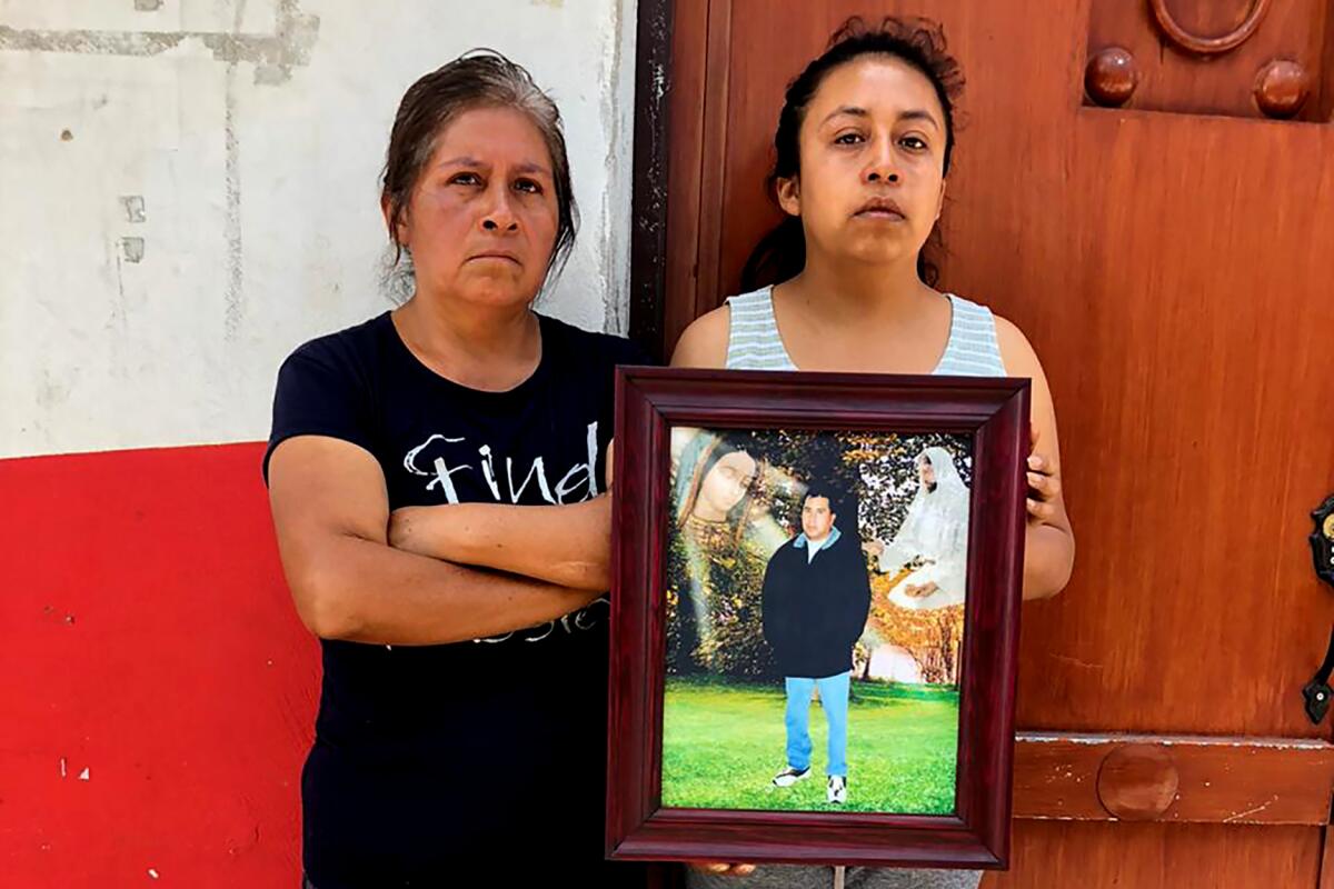 Maclovia Zacatenco and daughter Saida Rojas outside home in La Magdalena Axocopan, Mexico
