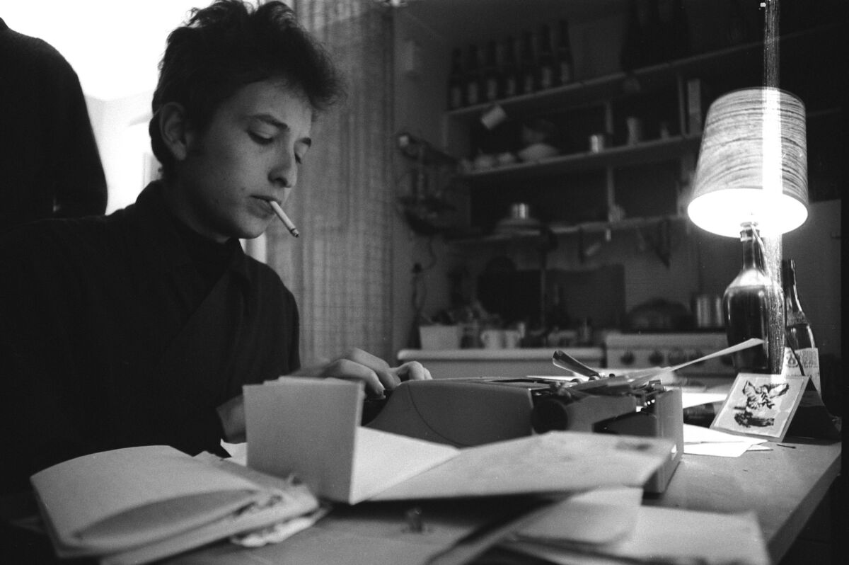 Bob Dylan at work in his Greenwich Village apartment, 1964.